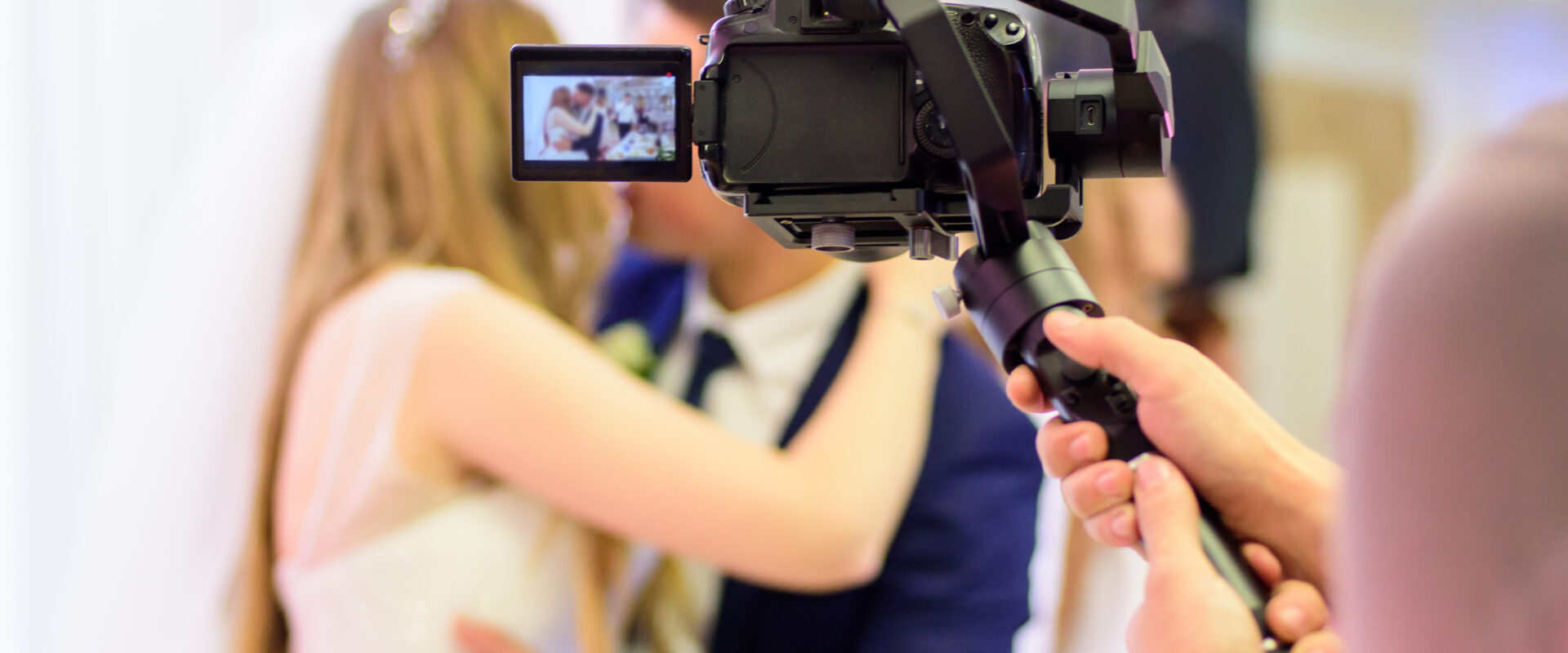 Cameraman recording video of a wedding