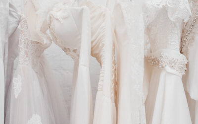 Banner White modern wedding dresses in dress store.