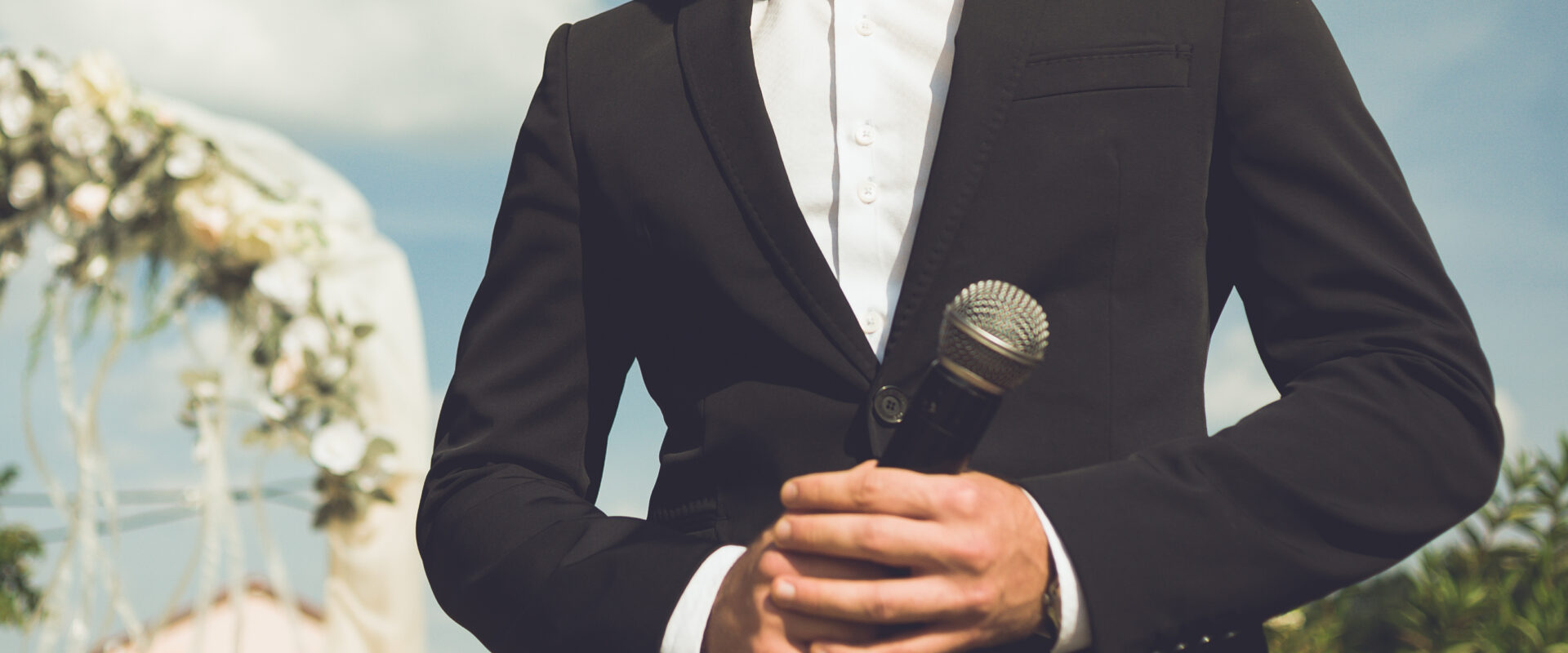 toastmaster at a wedding. mc.