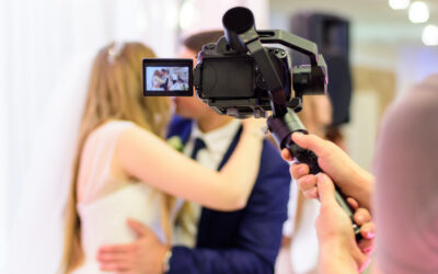 Cameraman recording video of a wedding