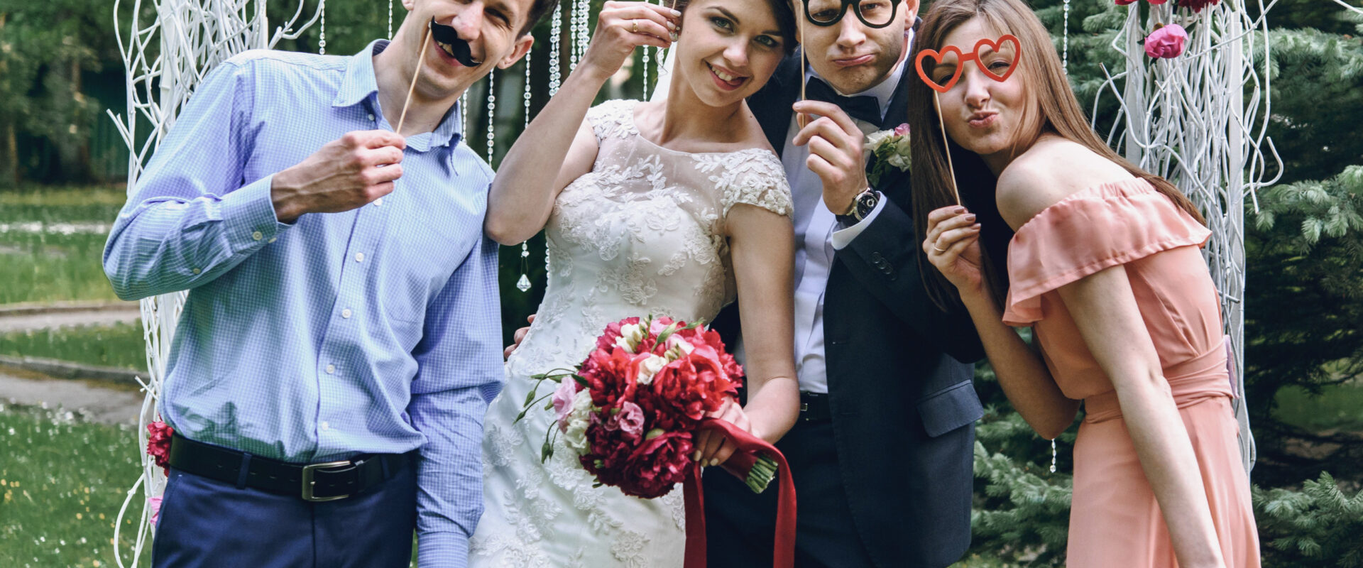 elegant stylish happy guests and bride and groom having funny ph